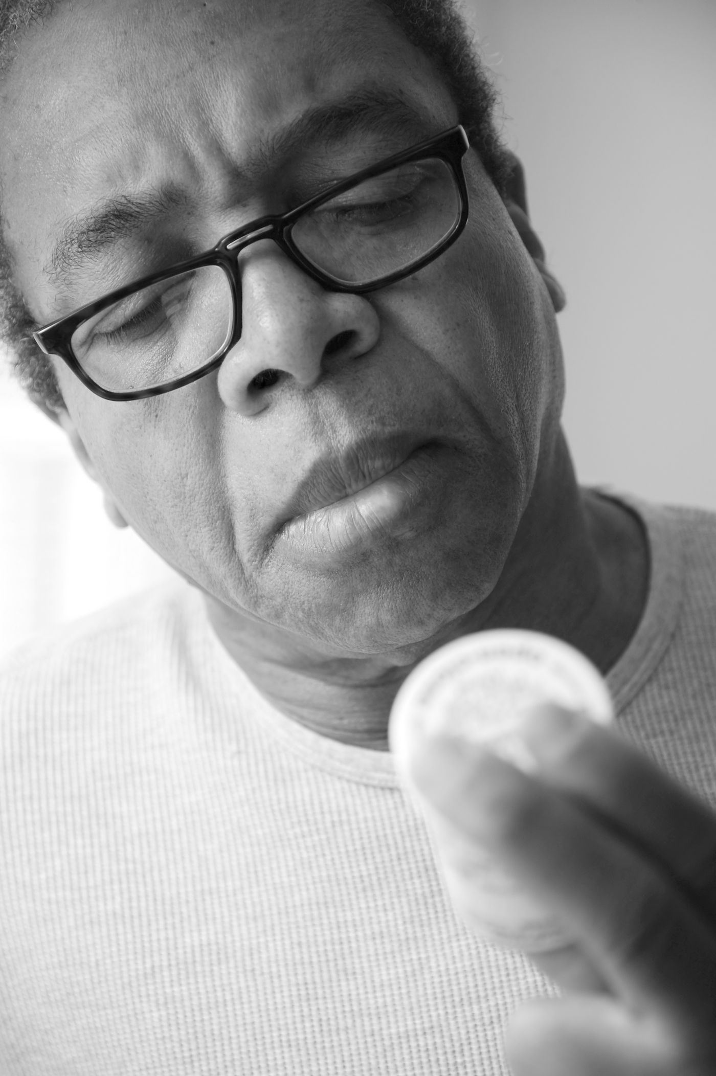 Senior man checking a medicine bottle